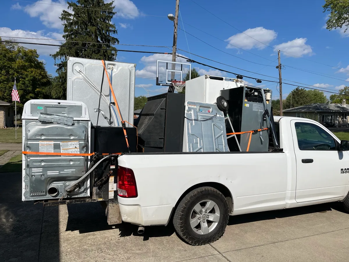 Truck bed loaded with washers and refrigerators picked up for $11 each across the Indianapolis metro