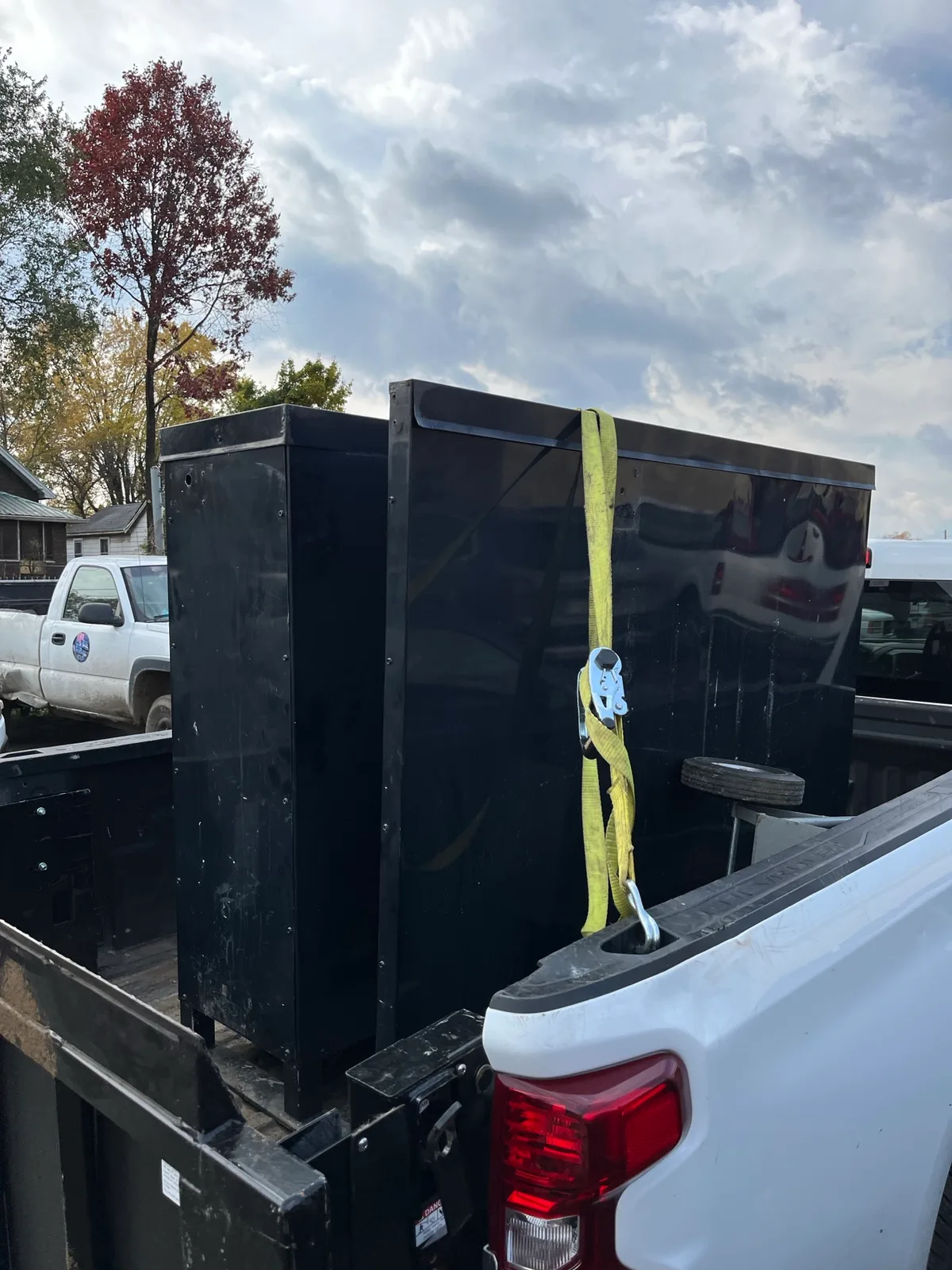 An empty Indy Pickup 1111 truck bed with a dolly ready to load at an Indianapolis garage cleanout