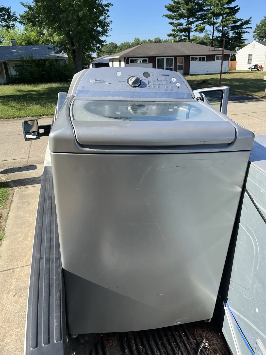 Used Whirlpool washing machine being collected for recycling by Indy Pickup 1111 in Indianapolis