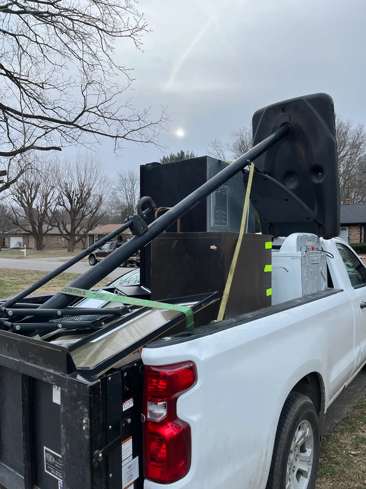 Washing machine and other appliances secured on a liftgate truck during an Indianapolis pickup
